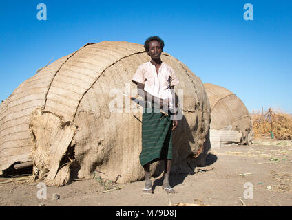 Afar tribe man in front of his hut, Afar region, Afambo, Ethiopia Stock Photo