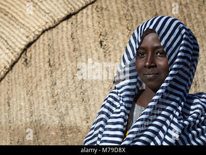 Afar tribe girl in front of her hut, Afar region, Afambo, Ethiopia Stock Photo