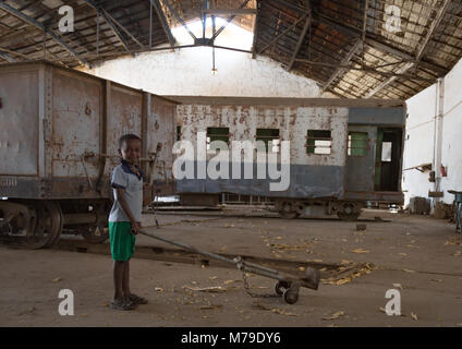 Kid playing inside the abandoned ethio-djibouti railway station, Dire dawa region, Dire dawa, Ethiopia Stock Photo