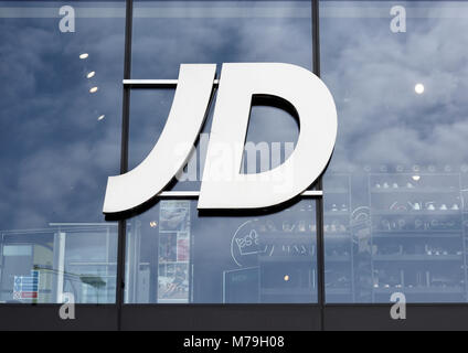 JD sports logo on glass store front, shop facade in bury toen centre, lancashire uk Stock Photo