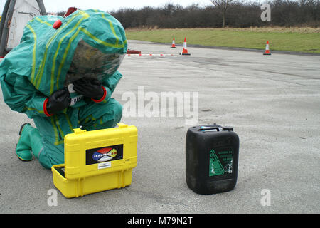 fire service Hazmat crew testing chemicals to identify Hazardous substance in emergency incident hot zone, chemical incident Stock Photo