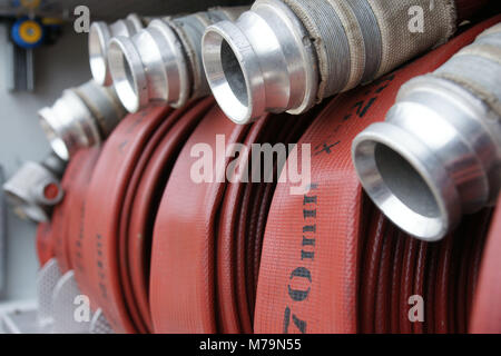 70mm fire fighting hose in fire engine locker ready to use, fire fighting equipment Stock Photo
