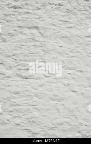 Background of whitewashed old stone wall that is rough and grungy, , whitespace Stock Photo