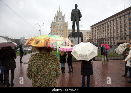 View of monument to the Soviet poet Vladimir Mayakovsky and Hotel Beijing on Triumphal Square in central Moscow on raining day Stock Photo