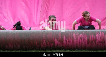 Women take part in the 'Pretty Muddy' charity run for Cancer Research UK  in Hammersmith on Wednesday 13 July 2016. Stock Photo