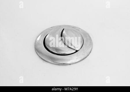 Toilet flushing buttons closeup Stock Photo
