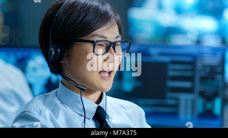 In the Customer Support Center Representative Makes Calls and Talks with Customer Through the Headset. Stock Photo