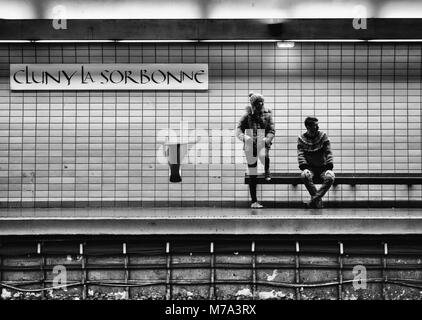 Paris, France - January 7, 2018: Passengers waiting for the train at the metro station of cluny la sorbonne, Paris. Stock Photo