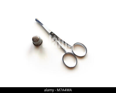 Embroidery scissors and thimble Stock Photo
