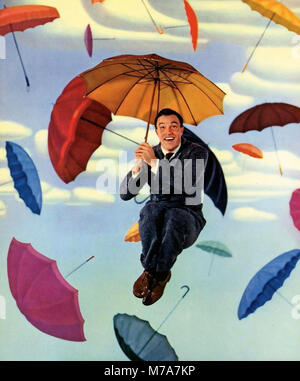GENE KELLY (1912-1996) American singer, dancer and film actor in a promotional photo for his 1952 film 'Singin' in the Rain' Stock Photo