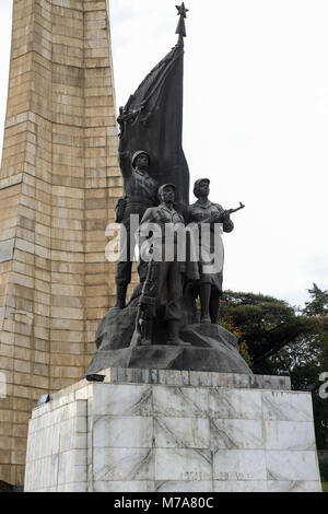 ETHIOPIA , Addis Ababa, The Tiglachin Monument, also known as Derg Monument at Churchill Avenue, Derg was the communist regime under dictator Mengistu Haile Mariam, is a memorial to Ethiopian and Cuban soldiers involved in the Ogaden War between Somalia and Ethiopia, inaugurated on 12 September 1984, the statuary was donated by North Korea, and was manufactured by the Mansudae Art Studio / AETHIOPIEN, Addis Abeba, Monument aus der kommunistischen Derg Zeit Stock Photo