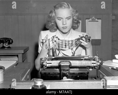 Blindfolded Woman at a Typewriter, #830179