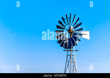 Steel Windpump in the semi desert Karoo region in South Africa Stock Photo