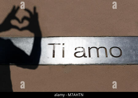 Ti amo inscription with with shadow of hands building a heart in the gardens of Trauttmansdorff Castle close Merano in South Tirol Stock Photo