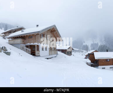 Austria, Montafon, Garfrescha alp village (1550 m), on the upper side of St. Gallenkirch. Quaint ski hut in the alp village. Stock Photo