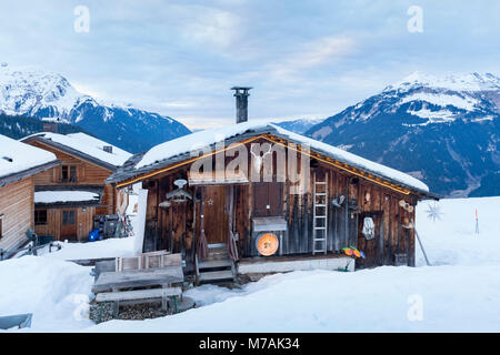 Austria, Montafon, Garfrescha alp village (1550 m), on the upper side of St. Gallenkirch. Quaint ski hut in the alp village. Stock Photo