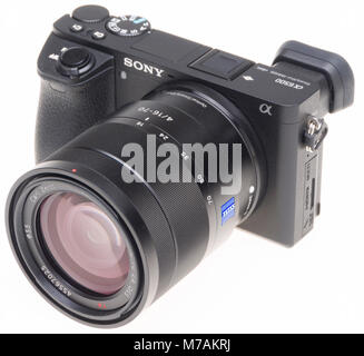 Camera isolated on white - Sony A6500 with Carl Zeiss 16-70mm f/4 lens Stock Photo