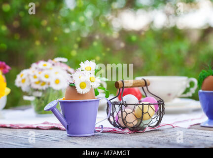 Easter decoration in a garden, Easter basket, Easter eggs Stock Photo