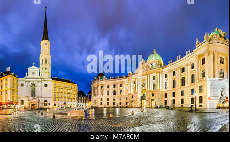 Michaelerplatz in Vienna, Austria at night with Hofburg and St. Michael's Church Stock Photo