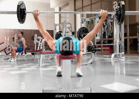 Two men exercising in a gym Stock Photo