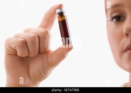 Close-up of a female doctor holding a vial Stock Photo