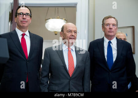 US Treasury Secretary Steven Mnuchin (L), US Commerce Secretary Wilbur Ross (C) and Director of the Office of US Trade Representative Robert Lighthizer (R) attend the signing of a presidential proclamation on steel and aluminum tariffs by US President Donald J. Trump, in the Roosevelt Room of the White House in Washington, DC, USA, 08 March 2018. President Trump is imposing tariffs on steel and aluminum imports. A decision to impose the tariffs on Canada or Mexico will not be decided until negotiations on the North American Free Trade Agreement (NAFTA). Credit: Michael Reynolds/Pool via CNP Stock Photo