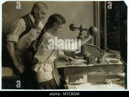 Embossing shop of Harry C. Taylor, 61 Court Street. 15-year old girl at embossing machine. LOC nclc.05165 Stock Photo