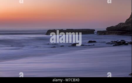 Scenic Dramatic After Sunset Landscape View Flat Rock Pacific Ocean Torrey Pines State Beach. Southern California Coastline North of San Diego Stock Photo