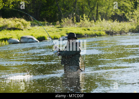 Caucasian Cowboy Fly Fishing In A Mountain Lake Stock Photo - Alamy