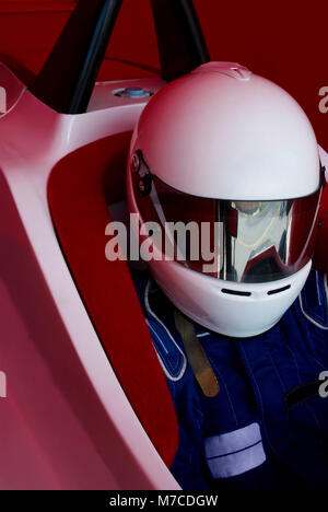 Close-up of a racecar driver in a racecar Stock Photo