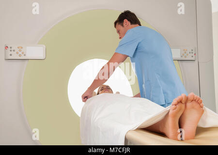 Patient going through an MRI scan Stock Photo