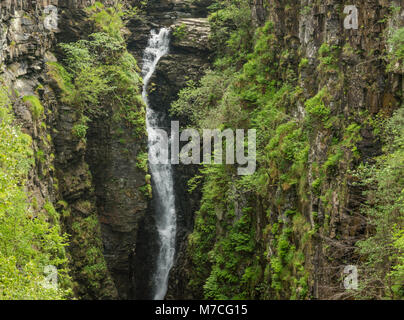 Braemore, Scotland - June 8, 2012: Closeup of waterfall of Corrieshalloch Gorge, a deep cut in landscape with forested vertical slopes. Landscape phot Stock Photo