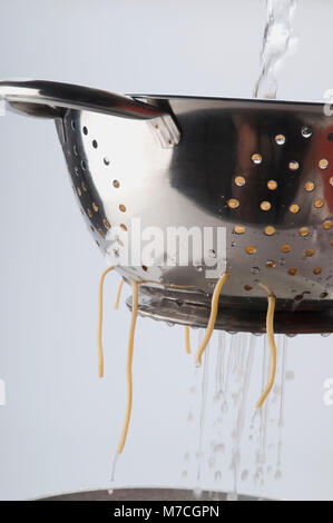 Close-up of boiled spaghetti in a strainer Stock Photo
