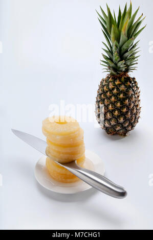 Close-up of a pineapple and pineapple slices Stock Photo