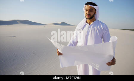 Serious young Arabian UAE Sheikh businessman considering constru Stock Photo