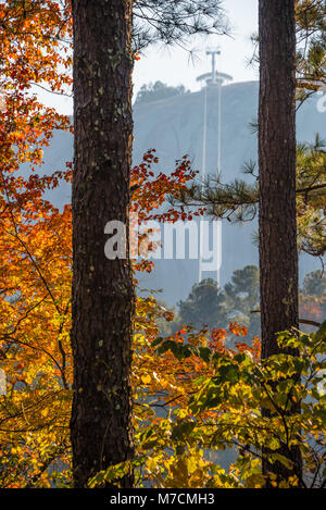 Atlanta, Georgia's Stone Mountain Park Summit Skyride cable car lines seen through the park's colorful autumn foliage. (USA) Stock Photo