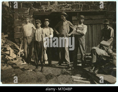 Group outside Pittman Handle Factory. A fifteen year old boy operating a dangerous boring machine at which he said a boy recently bored half his hand off. To operate this machine (which LOC cph.3b05704 Stock Photo