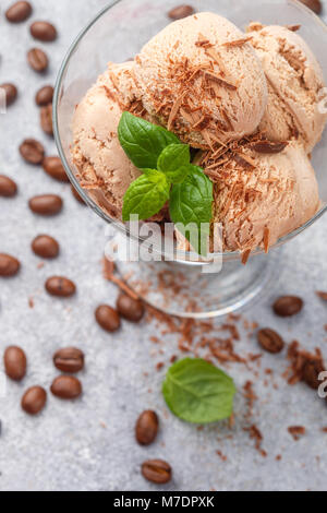 Homemade coffee ice cream with chocolate and mint. Selective focus Stock Photo