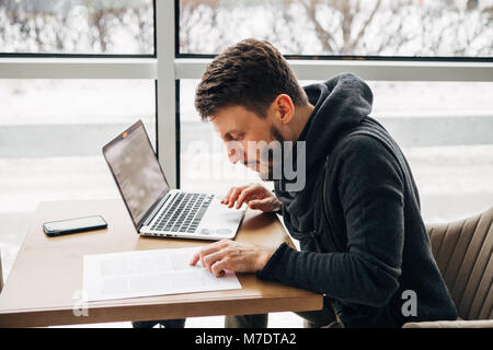 Businessman working, businessman in cafe, businessman looking at documents Stock Photo