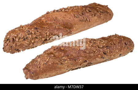 Wholegrain baguettes sprinkled with sunflower seeds. Two freshly baked crunchy bread rolls with a golden crust. Isolated on white background. Stock Photo