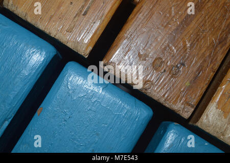 Unveven Gap of Blue and Brown Wooden Bench Stock Photo