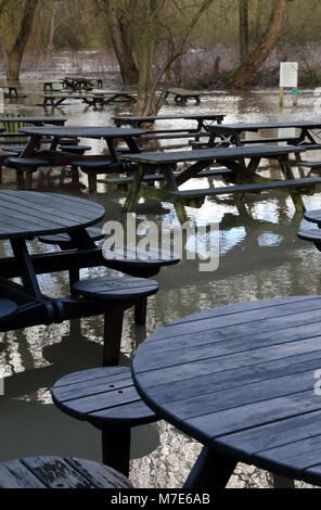 Floodwater from The River Ouzel surrounds tables and benches at the Globe Inn, Linslade, Bedfordshire, UK. Stock Photo