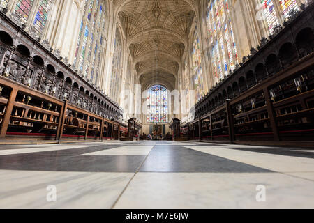 The choir with its floor, stained glass windows, and fan ceiling in the chapel at King's college, university of Cambridge, England. Stock Photo