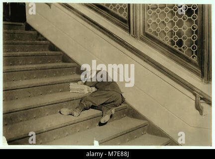 Newsboy asleep on stairs with papers. LOC cph.3a26047 Stock Photo