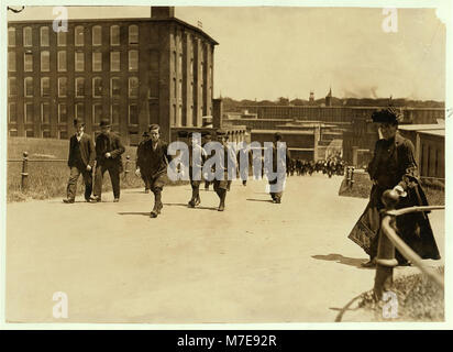 Noon hour, May 26, 1909. These boys and many smaller ones work in Amoskeag Mfg. Co., Manchester, N.H. LOC nclc.01788 Stock Photo