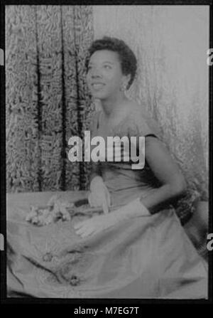 United States: 1956 A portrait of Althea Gibson holding a tennis racket