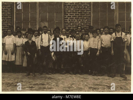 Shaw Cotton Mills. Overseer grouped all the workers, and several of them are surely under 13, and several began work under 13 last year. LOC nclc.02975 Stock Photo