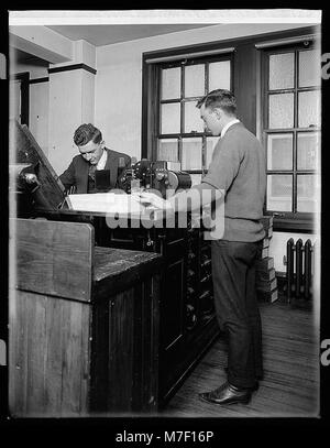 A historical photograph of a tabulating machine used by the U.S. Census ...