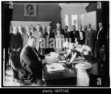 This photograph captures President William Howard Taft signing the ...