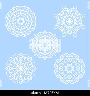 Vector set of five round snowflakes. Illustration of white mandalas on blue background Stock Vector